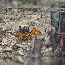 Demolition of structure by excavator