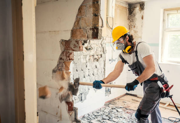 Worker with sledgehammer